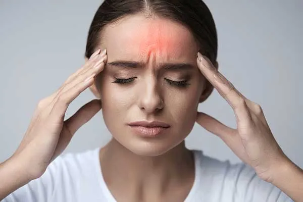 Woman with a headache — Headaches / Migraines care in Weymouth, MA